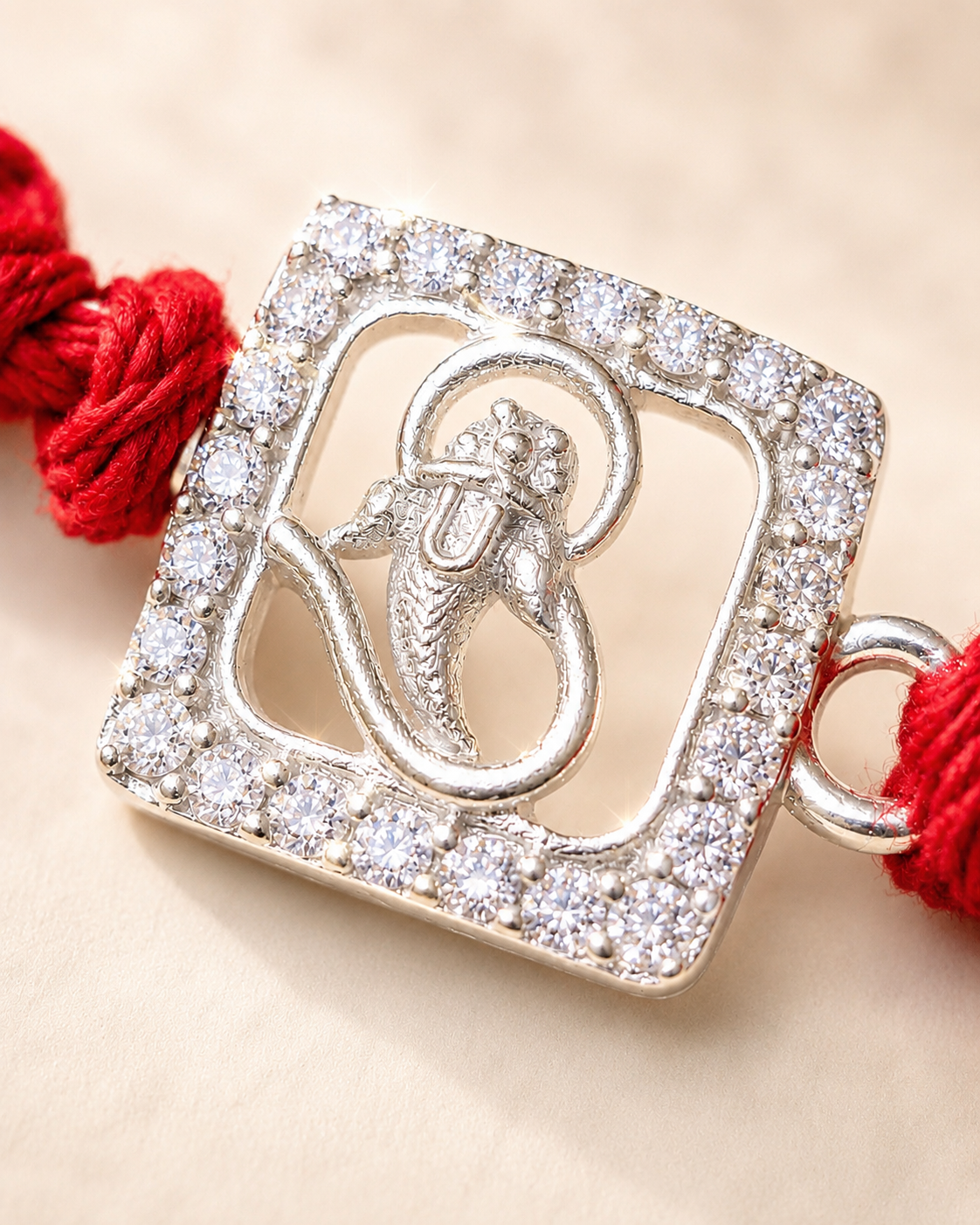 Stone-Studded Ganesha Silver Rakhi